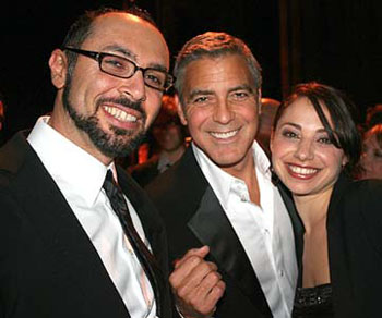 Yoav Potash celebrates with his wife Shira Potash and actor George Clooney